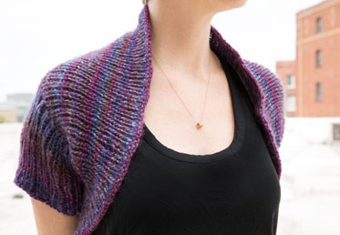 Come join Maggie Pace in this online knitting class with this shrug garment making project.  This sweater is knit all in one piece so there is no seaming and the back is knit from side to side with distinctive color yarn gradation.