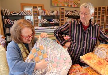 Kaffe Fassett and Liza work together to create a masterful medallion quilt in rich, warm tones. The quilt begins with a stunning medallion center that is comprised of English paper-pieced hexagon rings and hand-appliqued fussy-cut fabrics. 