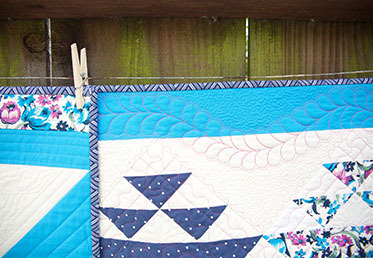 Sue Nickels and her daughter Ashley present two fun projects in their preferred styles—Sue is a traditional quilter and Ashley is a modern quilter. Though they each used the same fabrics, their finished quilts have totally different aesthetics. 