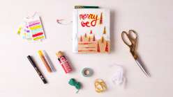 An art journal with the title Merry Be from Dawn Sokol's Holiday Art Journaling class on Creativebug.