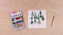 A watercolor painting of a forest of trees connected by a long strand of holiday lights from Maria Carluccio's Celebrate the Season Daily Holiday Painting Practice class on Creativebug.