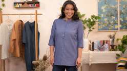 Sanae Ishida wearing a light blue chambray tunic on the set of her Draft and Sew a Banded Collar Dress and Button-Down class on Creativebug
