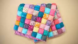 A colorful puff quilt made by Faith Hale in her Sew a Puff Quilt class on Creativebug