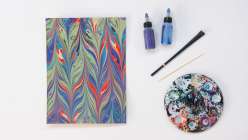 Blue, green, yellow marbled paper from Mercedez Rex's Creativity Through Marbling daily practice class on Creativebug