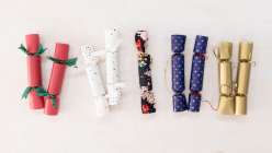 Paper and cloth party crackers made by Cobrina from her Make Prize-Filled Party Crackers class on Creativebug. 