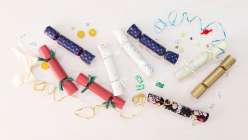 Paper and cloth party crackers and small prizes made by Cobrina from her Make Prize-Filled Party Crackers class on Creativebug. 