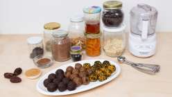 A plate of bliss balls plus all the ingredients needed for Cobrina's Creativebug class Bliss Balls: 3 Recipes for Snacking.