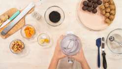 A plate of bliss balls plus all the ingredients needed for Cobrina's Creativebug class Bliss Balls: 3 Recipes for Snacking.