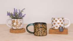 Three handmade mugs made by Cindy Willingham in her Surface Design on Ceramics class on Creativebug.