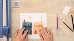 Two colorful paper houses made by Dawn M. Cardona in her Make a Wish Paper House class on Creativebug