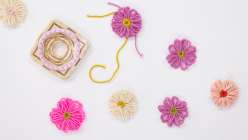 A selection of hand-loomed flowers made by crochet artist Twinkie Chan in her Flower Loom Basics class on Creativebug 
