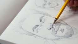 A portrait of a man being drawn by David Tenorio in his Drawing Portraits in Ballpoint Pen class on Creativebug.