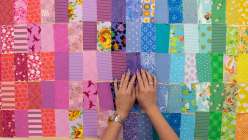 Taiga from House of Taiga making a patchwork fabric in her her Rainbow Gradient Quilted Coat class on Creativebug.