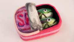 A felted tin of sardines made by Risa Iwisaki Culbertson in her Creativebug class Needle Felting: Three Techniques for Sculpting Tinned Fish.