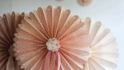 Lia Griffith teaches you how to make scalloped, frilly paper fans that are perfect for a diy wedding or backyard party project. Learn a fold-up version made with a Cricut Explore cutting machine or hand paper crafting.