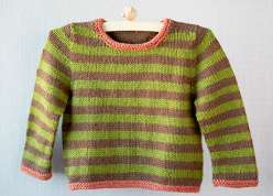 Gudrun Johnston teaches you to make this adorable striped toddler sweater knitting project. This is a seamless quick knit sweater with a striped or solid yarn color with a contrasting hem and cuff, worked up in worsted weight yarn.