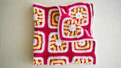 Over the course of four weeks, learn how to make this cheerful baby blanket alongside crochet expert Edie Eckman. Two easy crochet squares are repeated over and over to create the design, and the entire blanket can be made with just three skeins of yarn. 