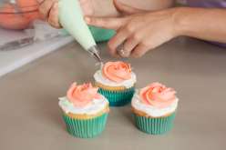 Emily Tatak from Wiltons teaches piping basics, consistency and color of buttercream, filling a cake-decorating bag, how to make pretty rosettes, classic swirls, adding stripes!