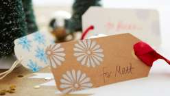 Stamped and Embossed Christmas Gift Tags: Courtney Cerruti shows how to create custom paper gift tags using rubber stamps, ink and embossing powder – perfect for topping off your holiday gift wrapping.