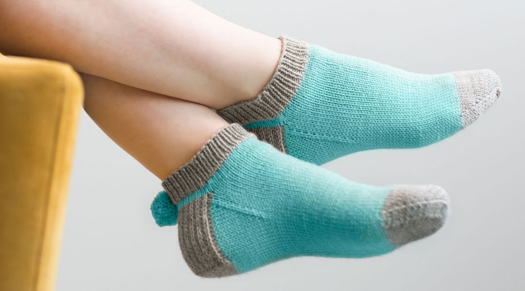 Learn how to knit pom pom socks with knitter and author Wendy Bernard of KnitAndTonic. Free knitting pattern included for subscribers. - Creativebug